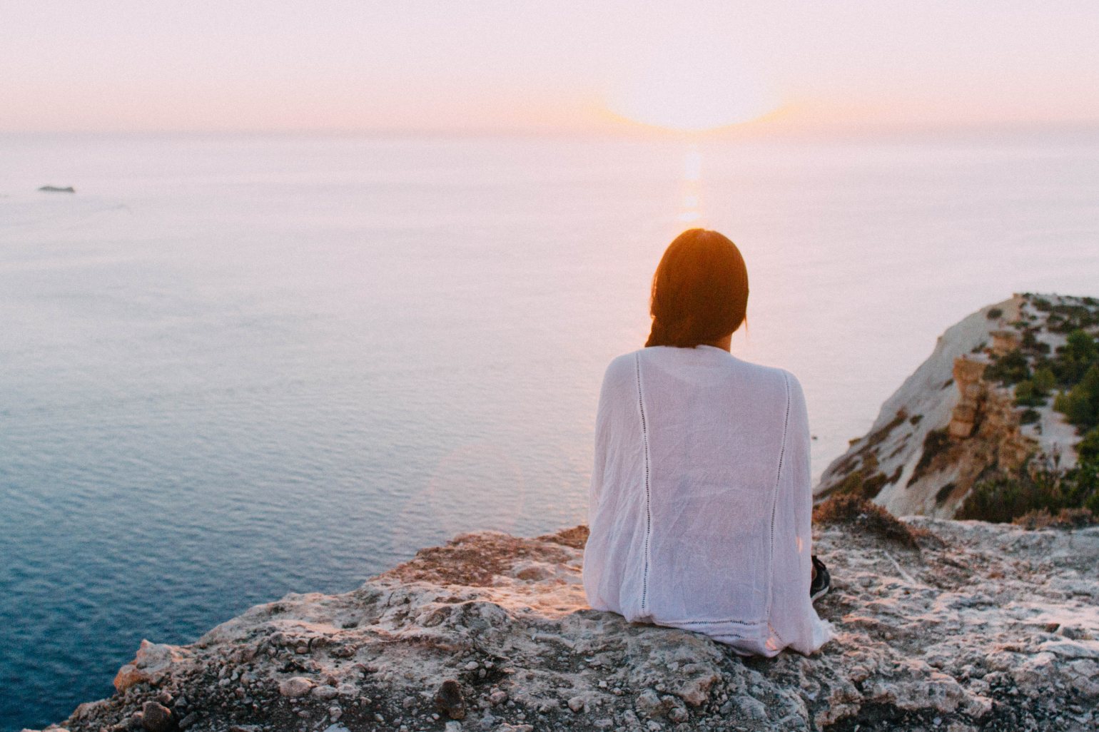 Woman relaxing by the ocean